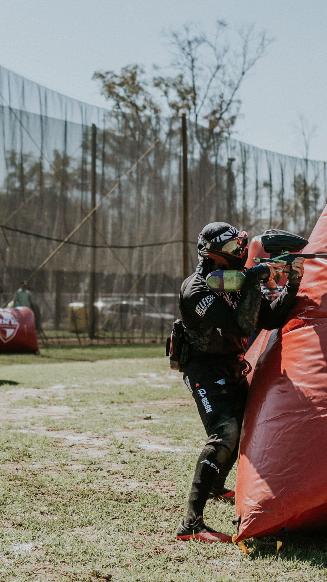 Player aiming from behind an inflatable bunker