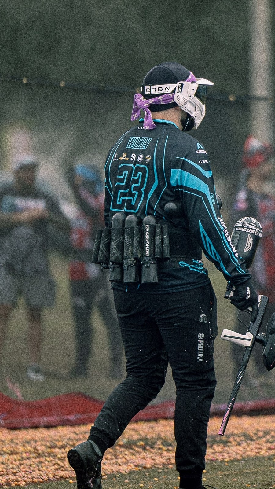 Wilson walking the field, pods loaded, after the point